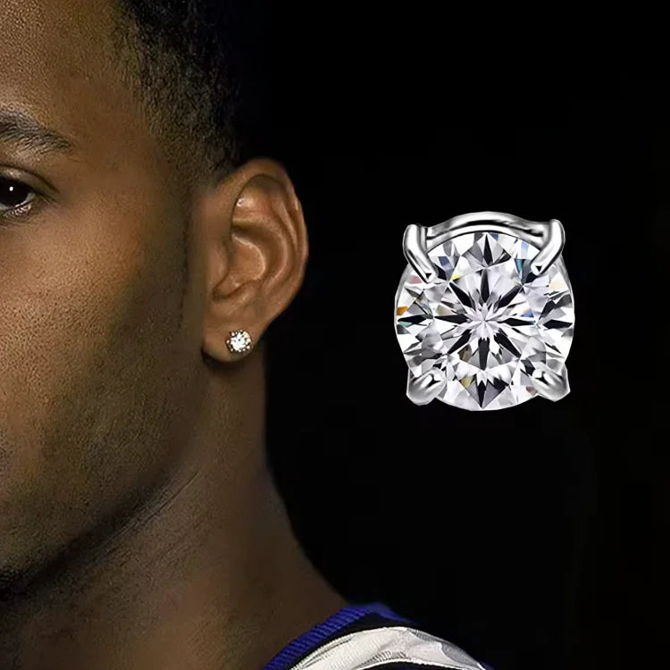Close-up of a man wearing a round solitaire stud earring with a sparkling clear gemstone